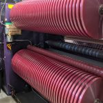 Thin red rolls on slitter
