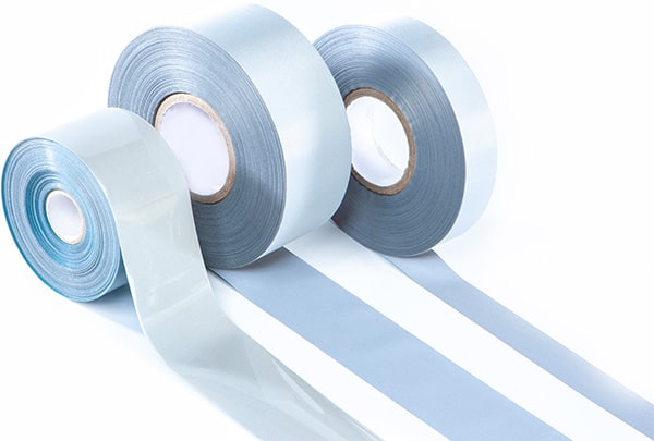 3 grey rolls of tape unrolling